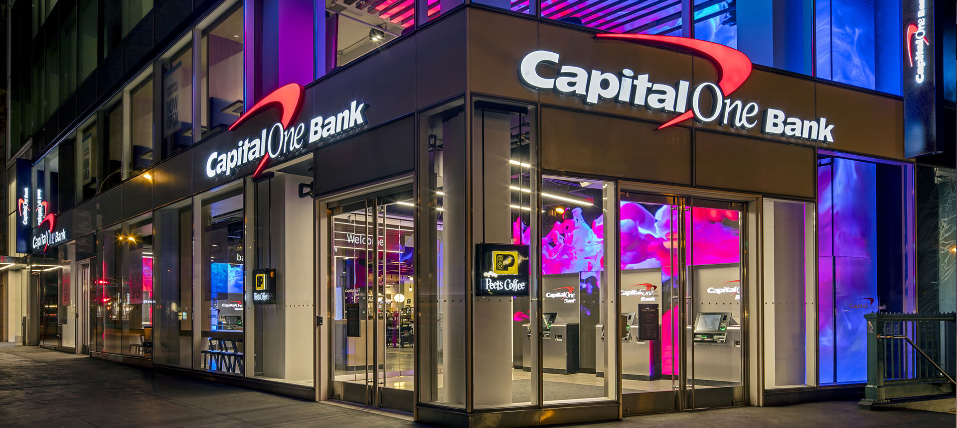 Nighttime Capital One storefront with LED content